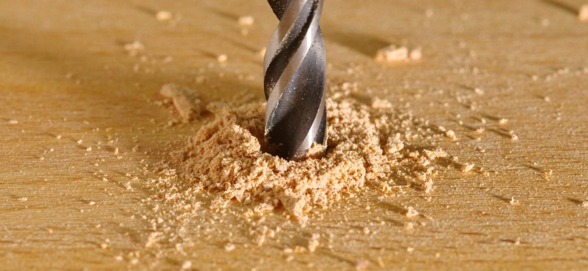 Close up of drill boring into wood