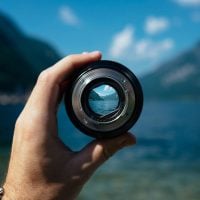 A mountain lake focused through a camera lens.